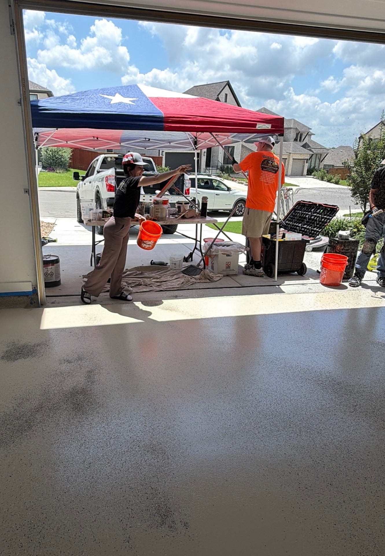 Cornerstone crew finishing a flake floor