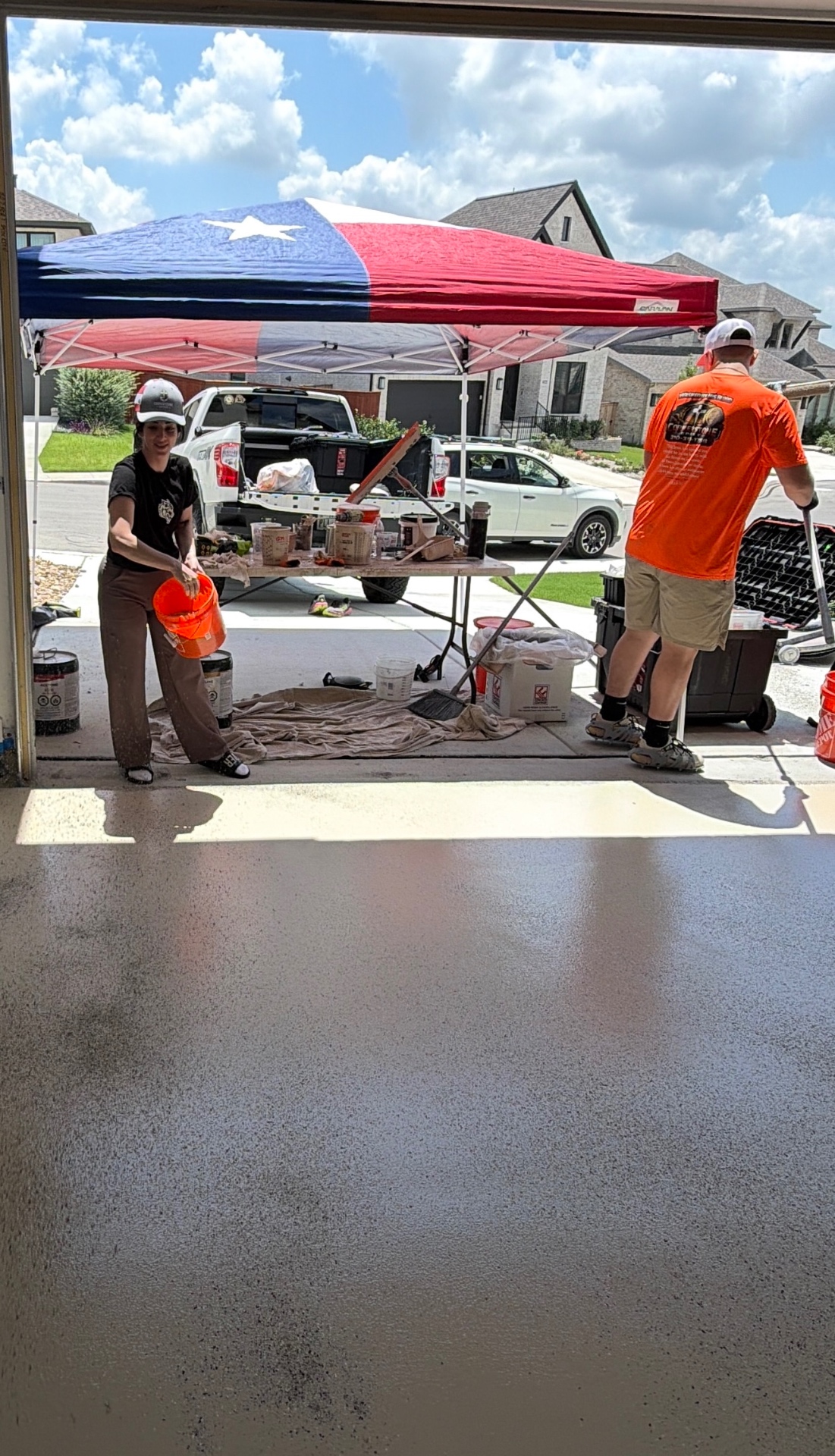 Team mixing epoxy on a residential driveway
