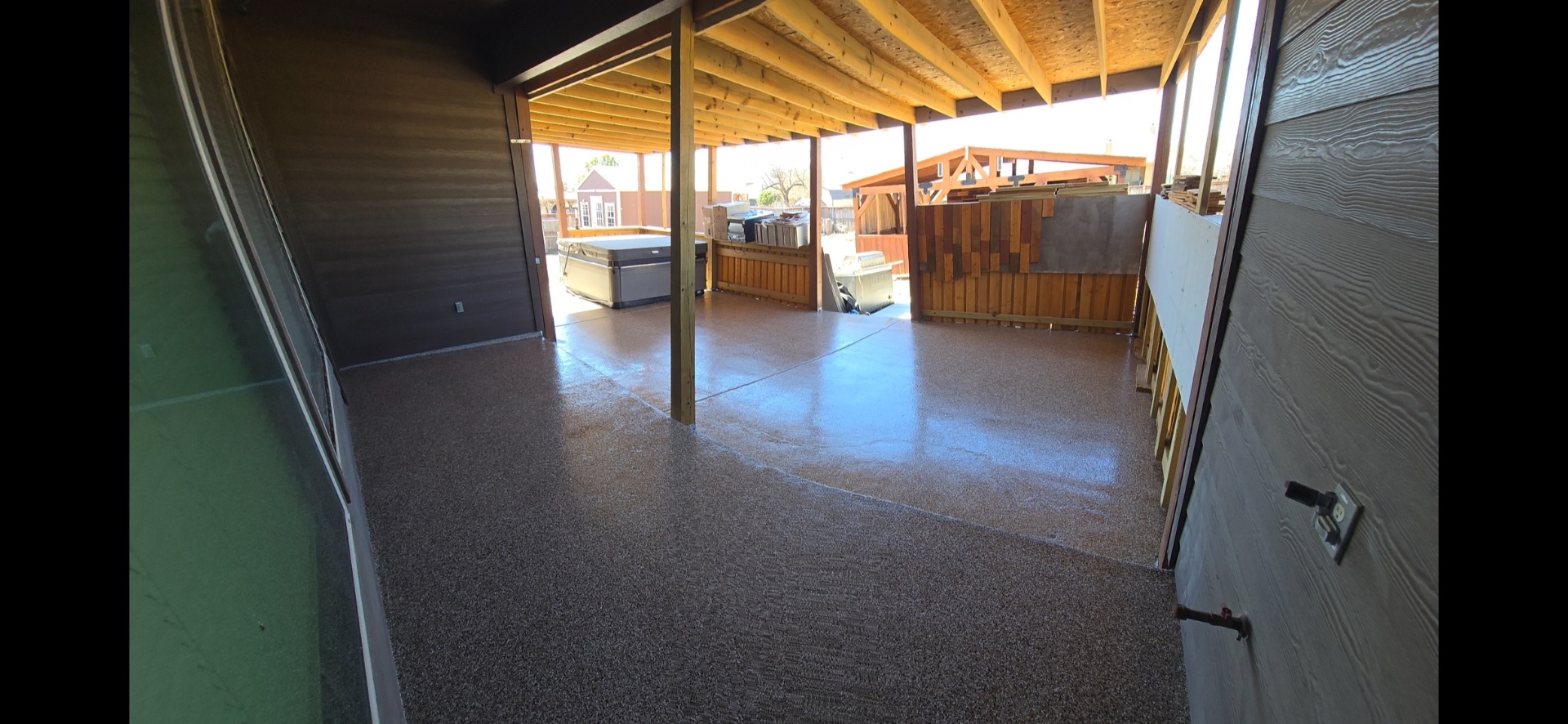 Finished flake floor on a covered backyard porch