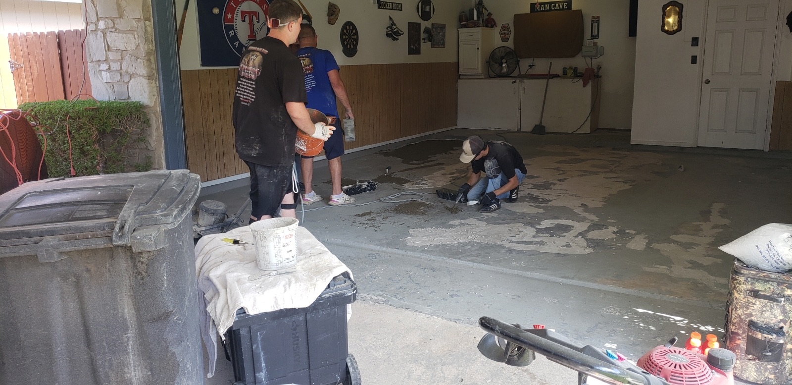 Cornerstone crew grinding and prepping a residential garage