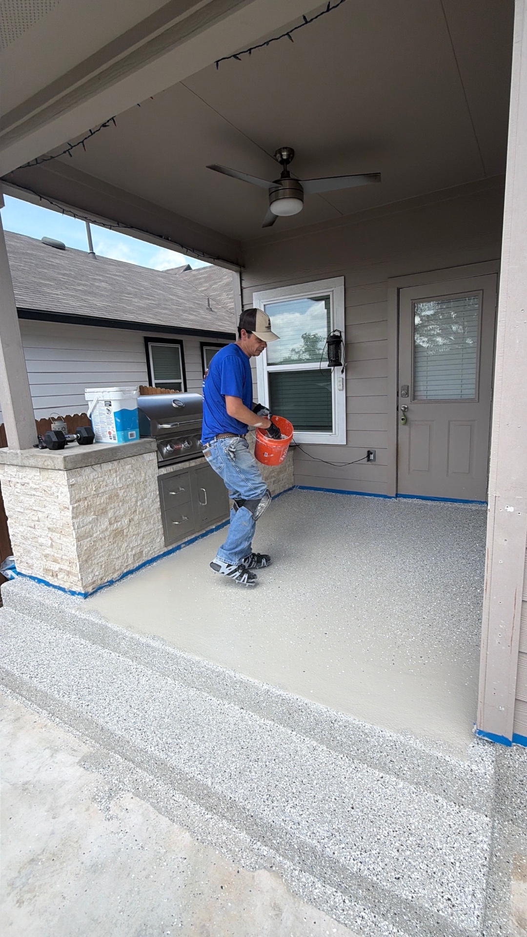 Outdoor patio flake coating in progress